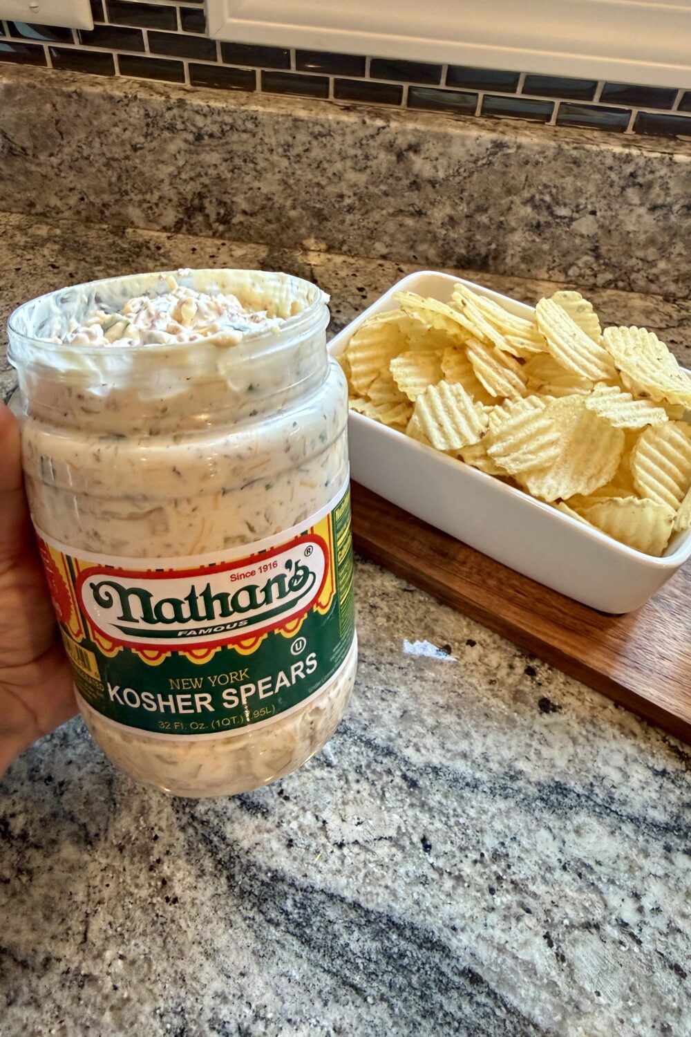 Viral pickle dip recipe with bacon, cheddar cheese and ranch seasoning in a serving bowl